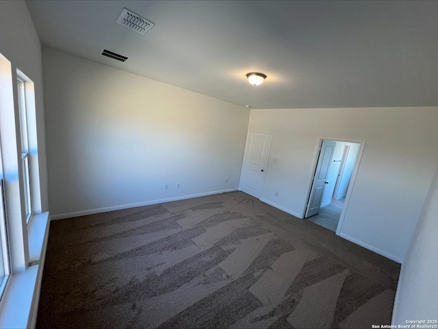 unfurnished bedroom featuring baseboards, visible vents, and carpet floors