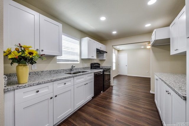 kitchen featuring dark wood-style flooring, a sink, black appliances, under cabinet range hood, and white cabinetry