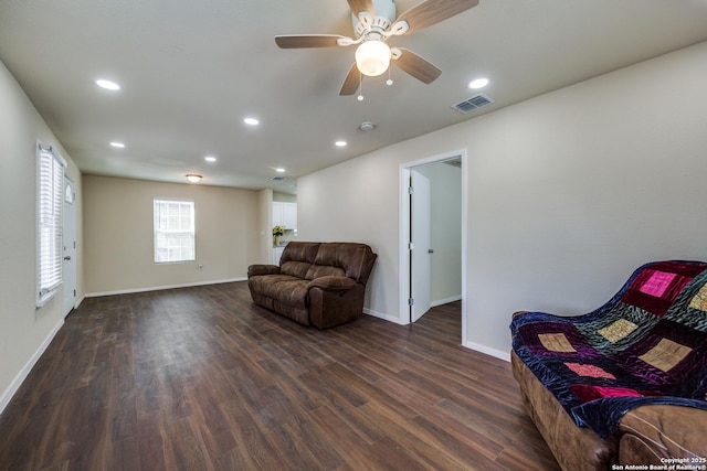 living room featuring recessed lighting, visible vents, baseboards, and dark wood-style floors