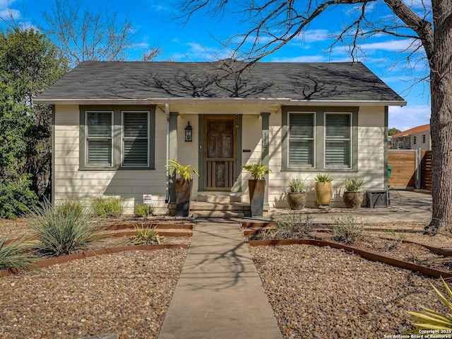 bungalow-style house featuring a shingled roof