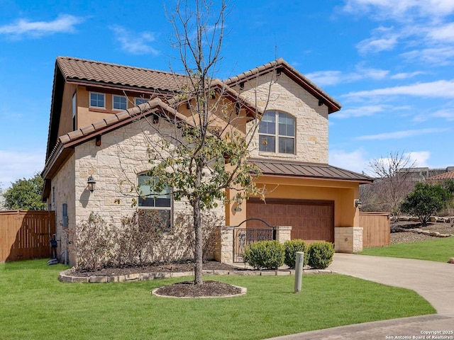 view of front facade with stone siding, driveway, a standing seam roof, and fence