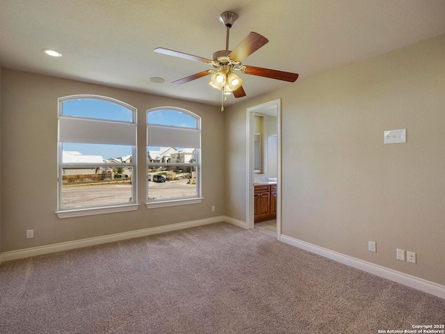 unfurnished room featuring a ceiling fan, recessed lighting, light colored carpet, and baseboards