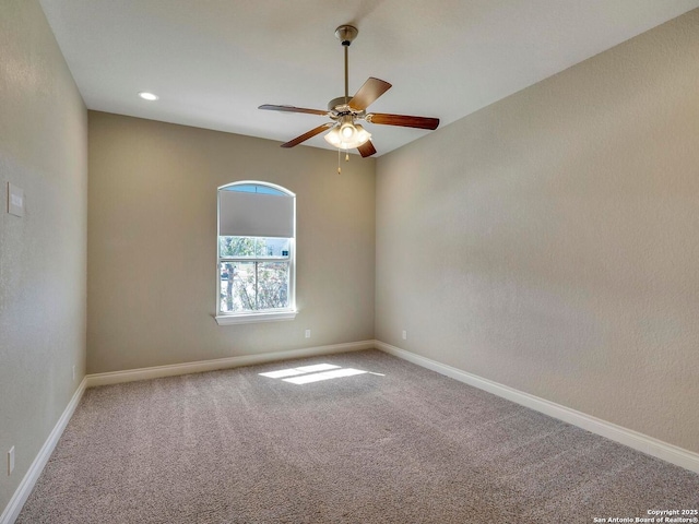 spare room featuring carpet flooring, recessed lighting, baseboards, and ceiling fan