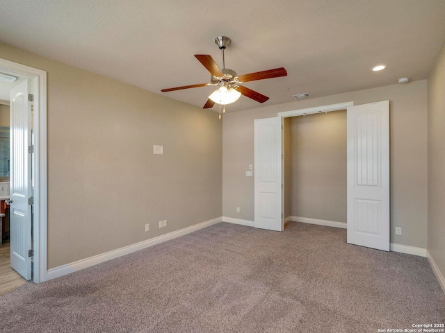 unfurnished bedroom with baseboards, carpet floors, and visible vents