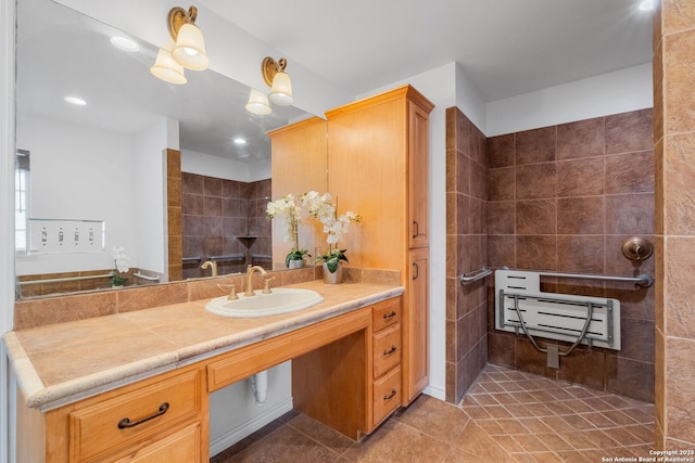 full bath featuring tile patterned flooring, vanity, and a walk in shower