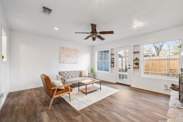 living room with visible vents, wood finished floors, recessed lighting, baseboards, and ceiling fan