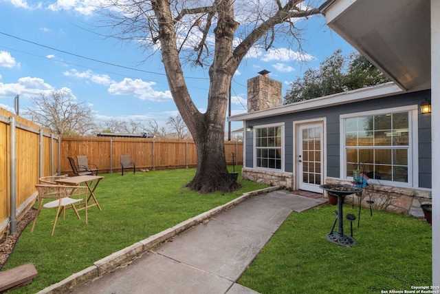 view of yard with a fenced backyard