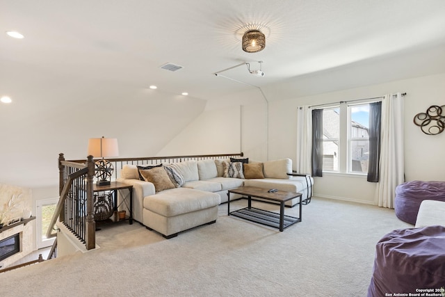 living area featuring recessed lighting, visible vents, light carpet, and baseboards