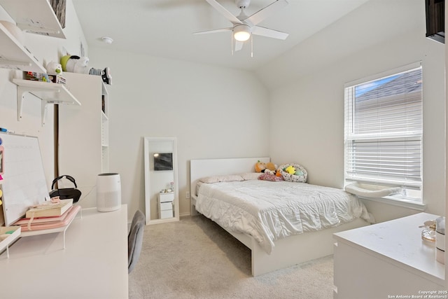 bedroom with light colored carpet, a ceiling fan, and vaulted ceiling