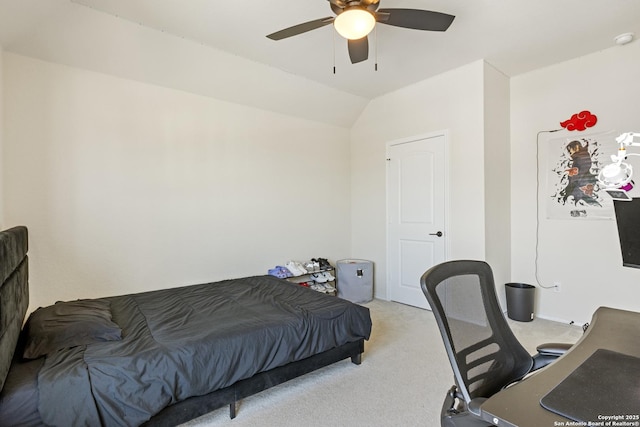 bedroom featuring vaulted ceiling, a ceiling fan, and light carpet