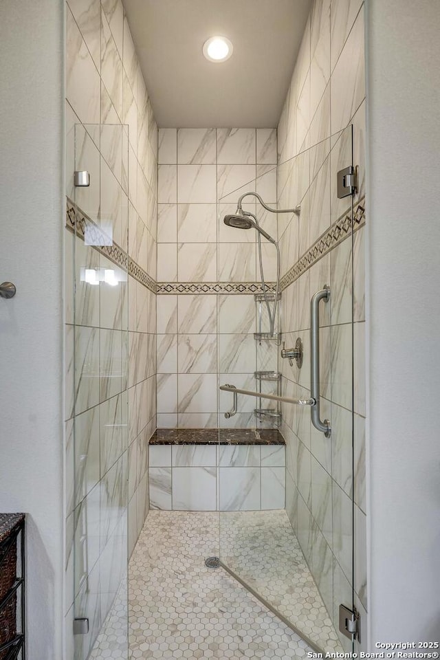 full bath with a shower stall