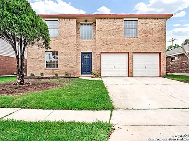 view of front facade featuring brick siding, concrete driveway, and an attached garage