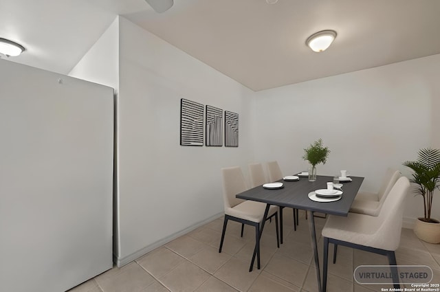 dining space with light tile patterned floors