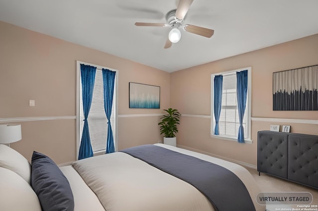 bedroom featuring a ceiling fan, baseboards, and carpet floors