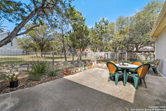 view of patio / terrace featuring outdoor dining space and fence