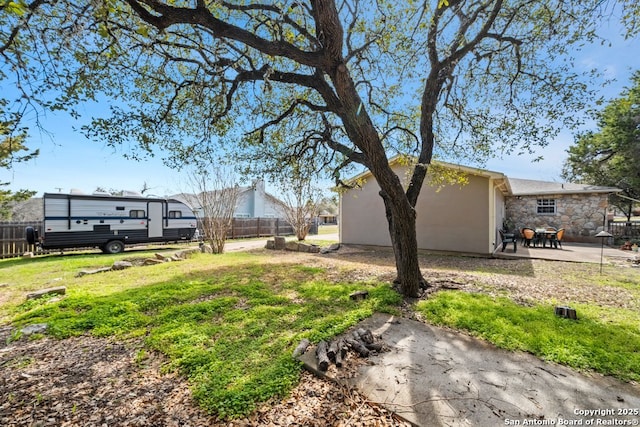 view of yard with a patio and fence