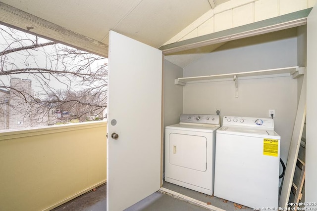 washroom featuring washing machine and dryer and laundry area