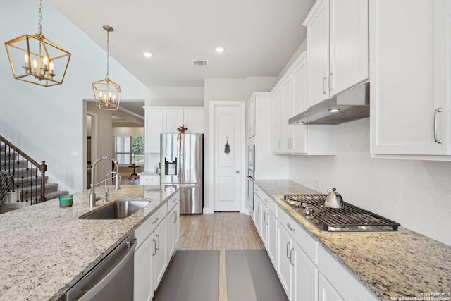 12519 Upton Park, San Antonio, TX 78253 - kitchen featuring visible vents, a sink, stainless steel appliances, under cabinet range hood, and tasteful backsplash