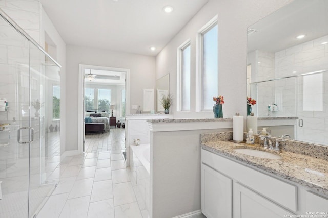 12519 Upton Park, San Antonio, TX 78253 - ensuite bathroom featuring vanity, ensuite bath, a tub to relax in, and a stall shower