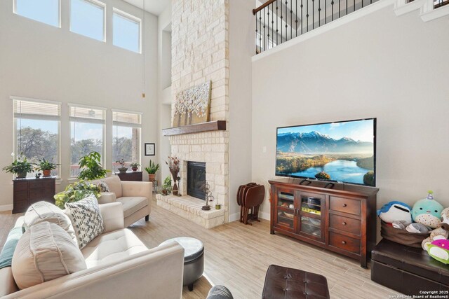 12519 Upton Park, San Antonio, TX 78253 - living room with a fireplace, wood finished floors, baseboards, and a wealth of natural light