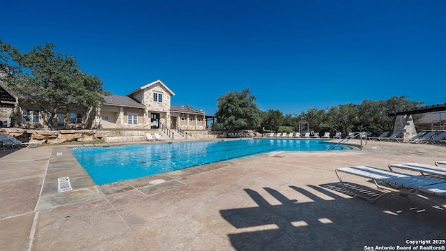 pool with a patio