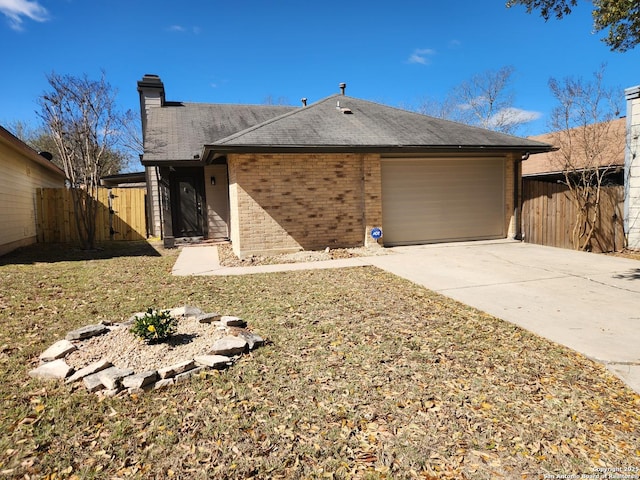 single story home featuring brick siding, concrete driveway, an attached garage, and fence