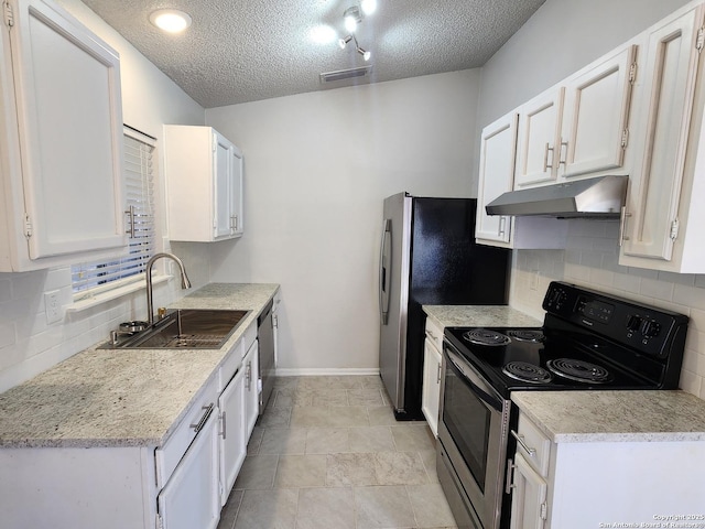 kitchen with visible vents, under cabinet range hood, appliances with stainless steel finishes, white cabinetry, and a sink