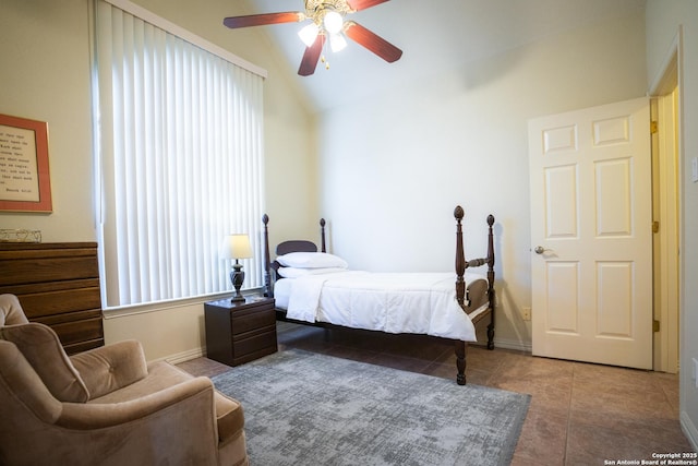 tiled bedroom with ceiling fan, baseboards, and lofted ceiling