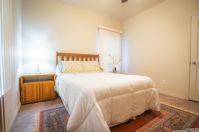 bedroom with baseboards and ceiling fan