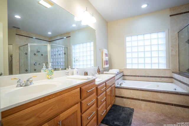 full bath featuring visible vents, a stall shower, a sink, double vanity, and a bath