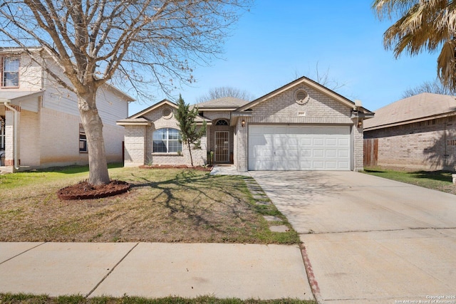 ranch-style home featuring a front lawn, brick siding, a garage, and driveway