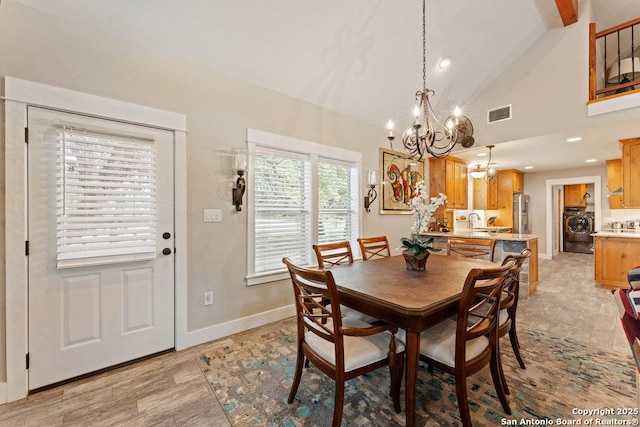 dining area with visible vents, baseboards, recessed lighting, washer / dryer, and an inviting chandelier