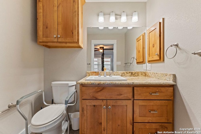 half bath featuring toilet and vanity