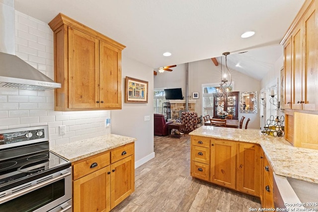 kitchen featuring wall chimney range hood, open floor plan, vaulted ceiling, decorative backsplash, and electric range