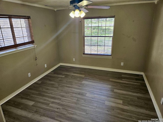 empty room with dark wood finished floors, a ceiling fan, baseboards, and ornamental molding