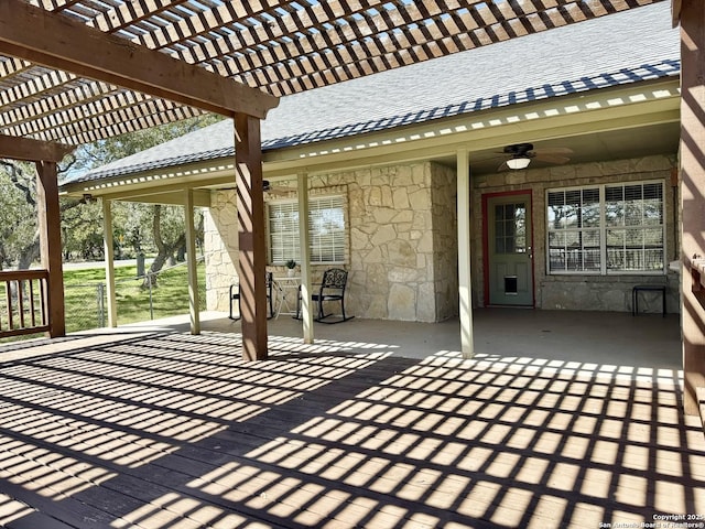 view of patio / terrace featuring ceiling fan and a pergola