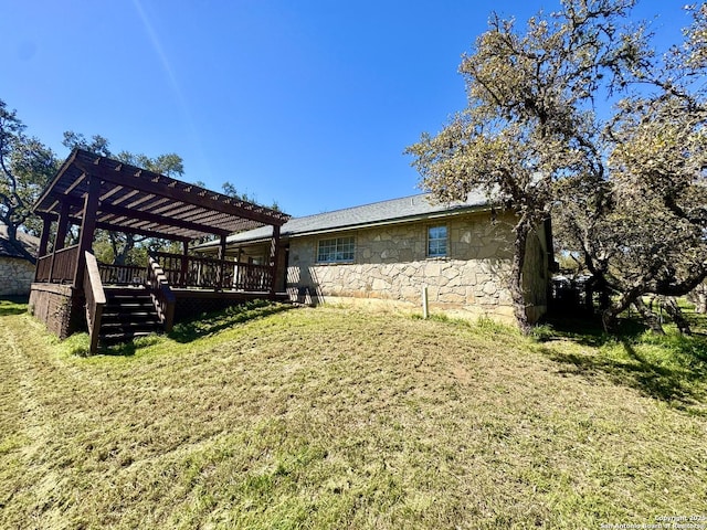 view of yard with a wooden deck and a pergola