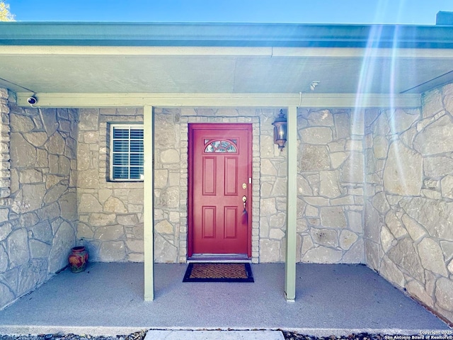 view of exterior entry with stone siding