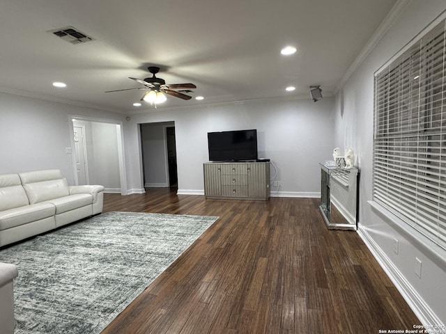 living area with recessed lighting, visible vents, ornamental molding, and dark wood-style flooring