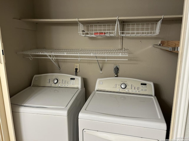 laundry area with washing machine and dryer and laundry area