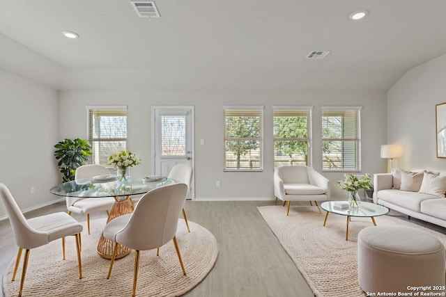 dining room with recessed lighting, visible vents, baseboards, and light wood finished floors