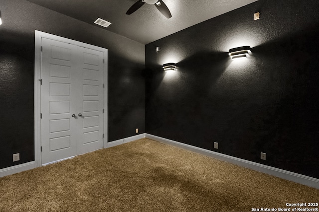 605 Albarella, Cibolo, TX 78108 - unfurnished room with carpet floors, a ceiling fan, baseboards, and a textured ceiling