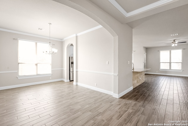 605 Albarella, Cibolo, TX 78108 - unfurnished living room featuring wood finished floors, baseboards, ornamental molding, ceiling fan, and a chandelier