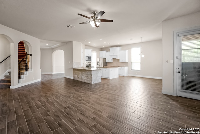 605 Albarella, Cibolo, TX 78108 - unfurnished living room with baseboards, ceiling fan, plenty of natural light, dark wood-style flooring, and recessed lighting