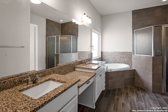 605 Albarella, Cibolo, TX 78108 - full bathroom featuring a stall shower, two vanities, a bath, and wood finished floors