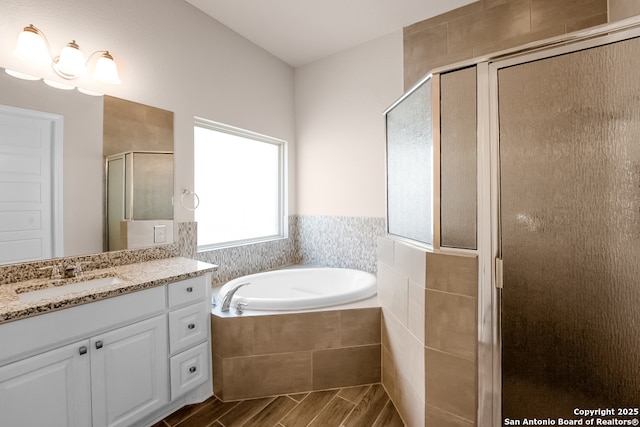 605 Albarella, Cibolo, TX 78108 - full bath with vanity, a stall shower, a garden tub, and wood finished floors
