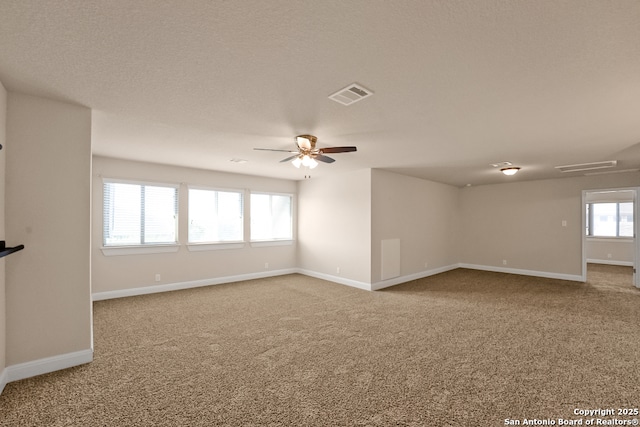 605 Albarella, Cibolo, TX 78108 - unfurnished living room featuring carpet flooring, baseboards, and ceiling fan