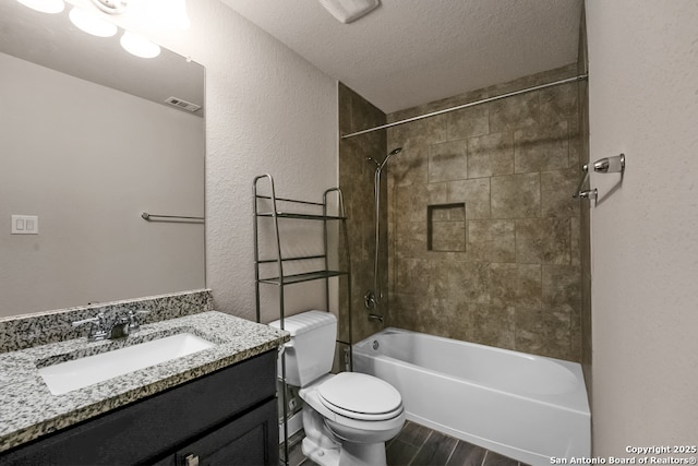 605 Albarella, Cibolo, TX 78108 - bathroom featuring toilet, bathing tub / shower combination, vanity, wood finished floors, and a textured ceiling