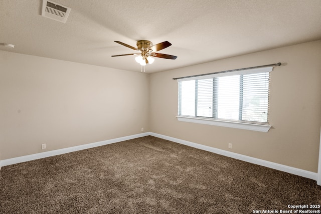 605 Albarella, Cibolo, TX 78108 - empty room with ceiling fan, dark carpet, baseboards, and a textured ceiling