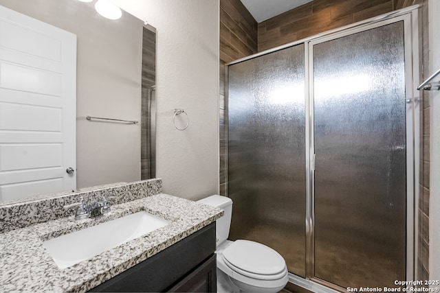 605 Albarella, Cibolo, TX 78108 - bathroom featuring vanity, a stall shower, toilet, and a textured wall